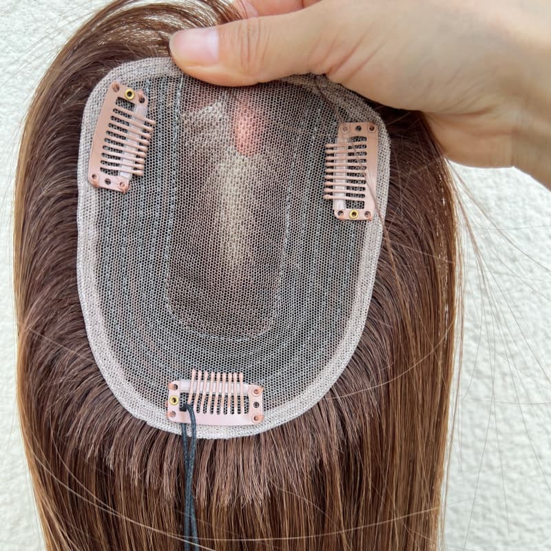 10 by 12 cm lace base with hand-tied center and clip attachments