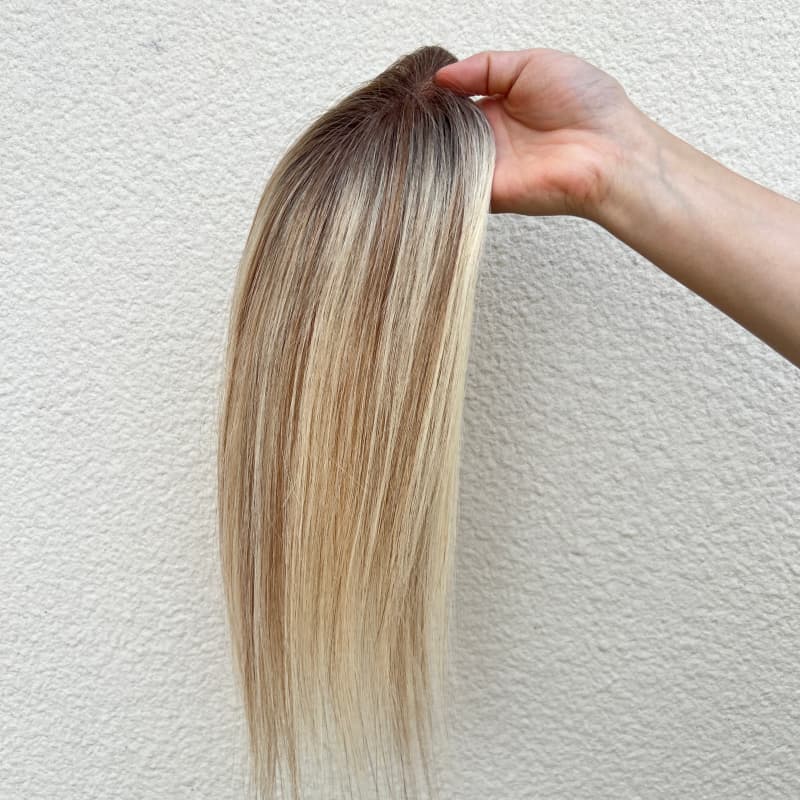 Golden gradient hair topper with subtle highlights
