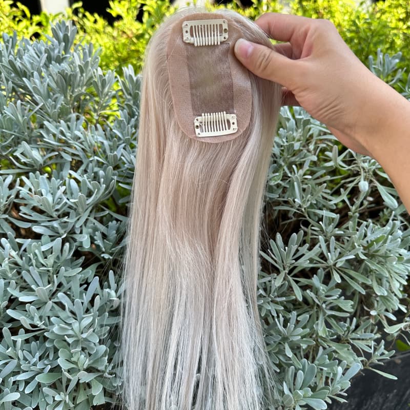 Compact mono base of platinum blonde hairpiece with clips