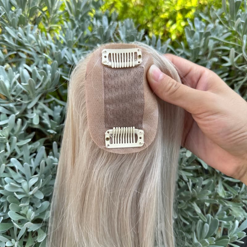 Full view of platinum blonde human hair topper