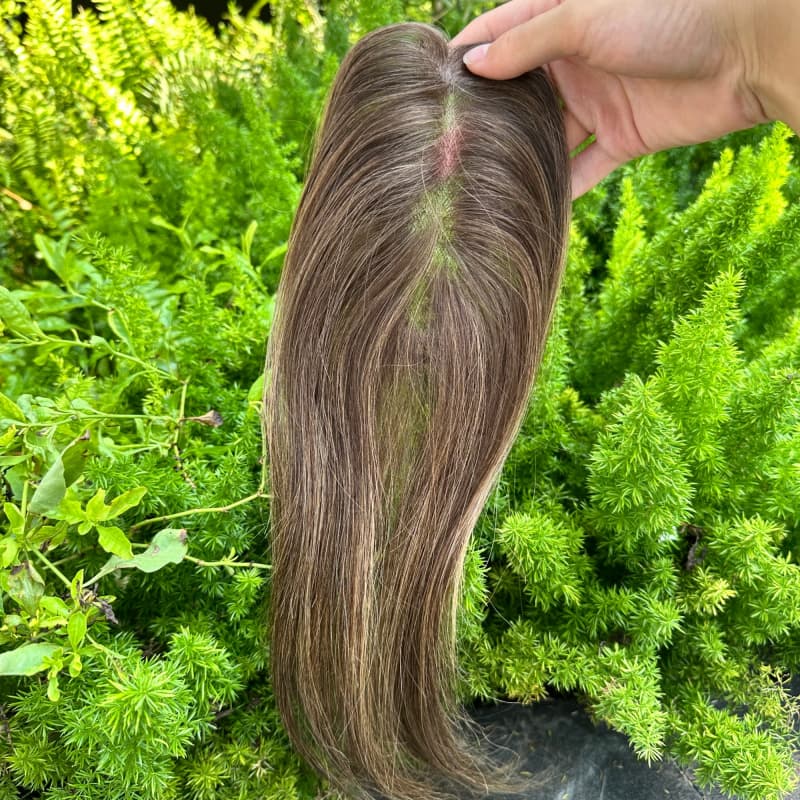 Underside of brown highlighted topper showing elongated mono base and clips