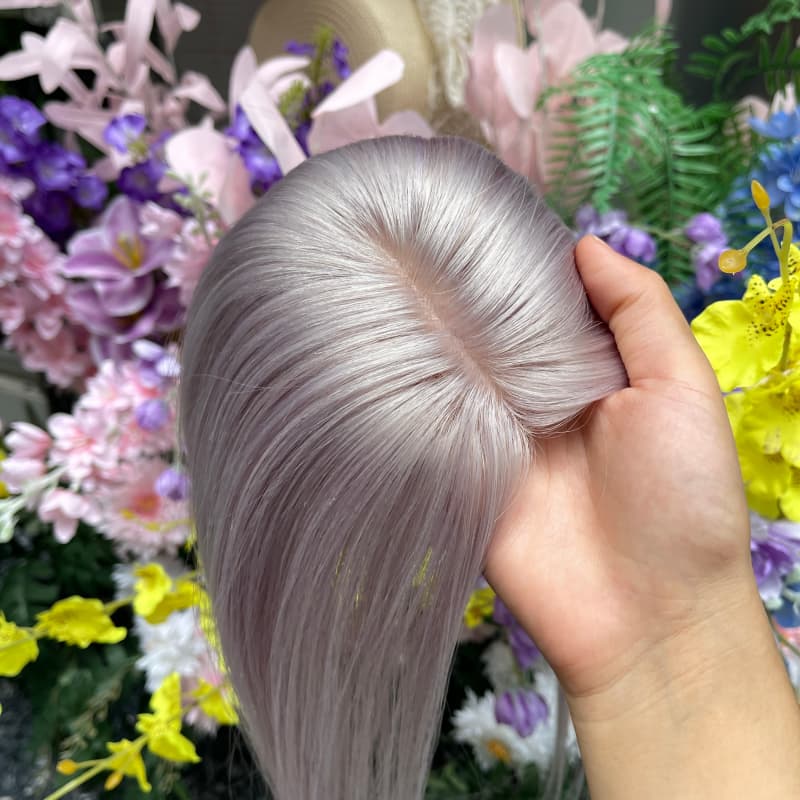 Close-up of scalp-like injected part on gray human hair topper