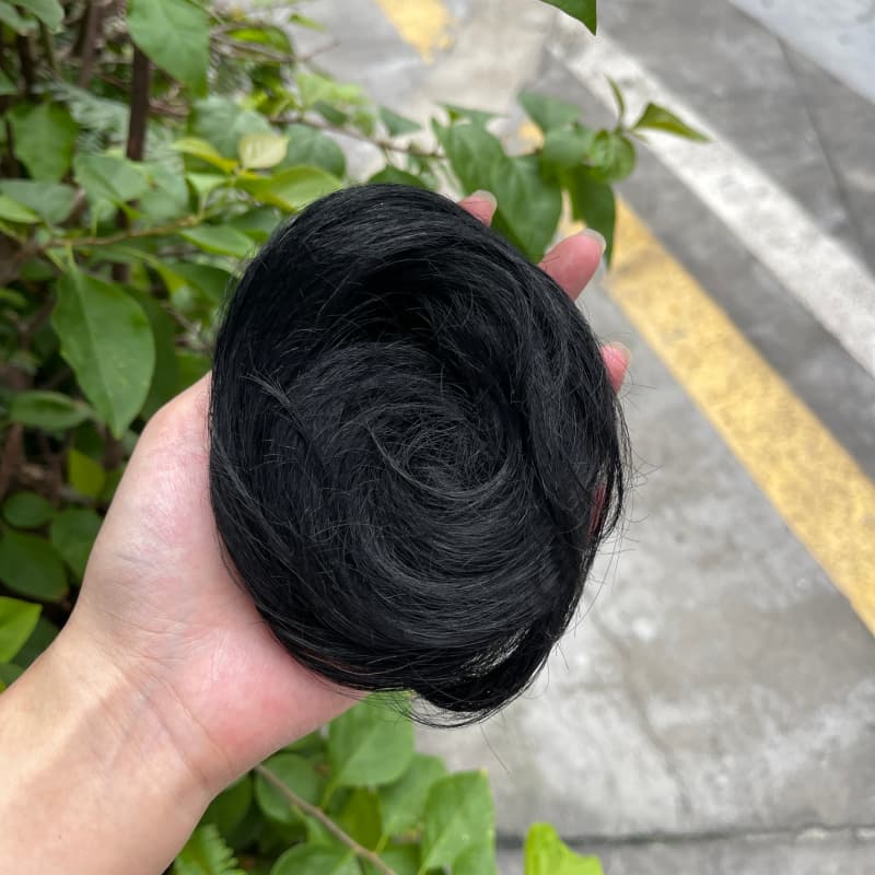 100% human hair bun scrunchie, color 1#, outdoor natural-light photo 1