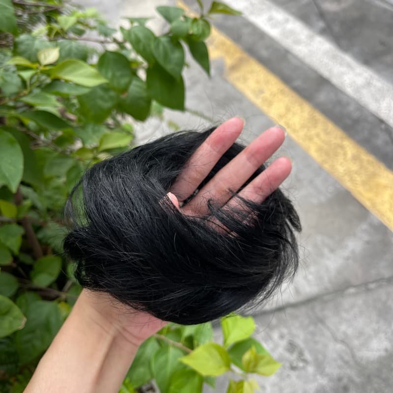 100% human hair bun scrunchie, color 1#, outdoor natural-light photo 4