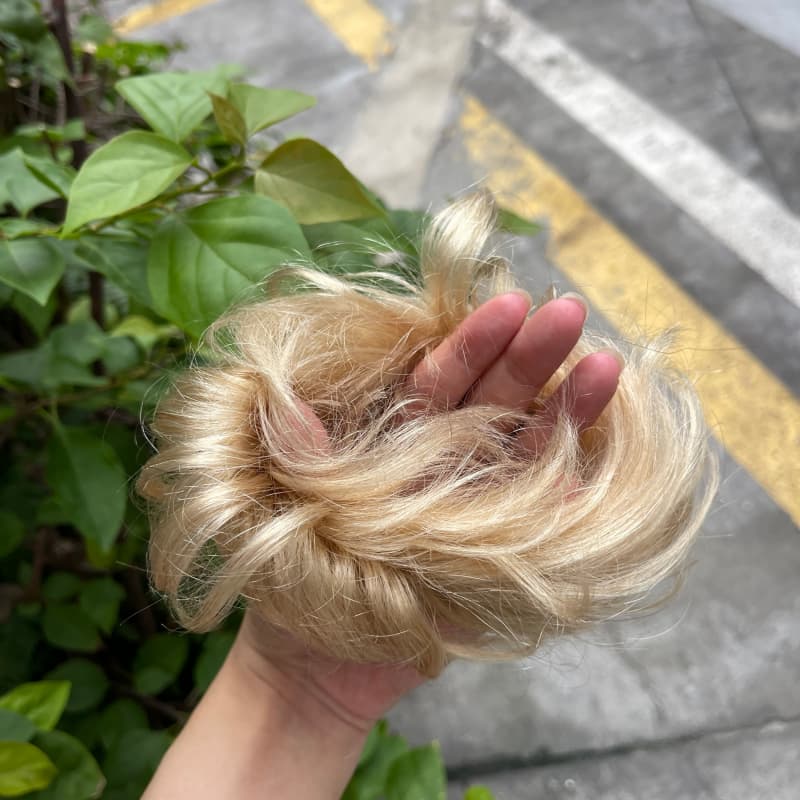 100% human hair bun scrunchie, color 16#, outdoor natural-light photo 5