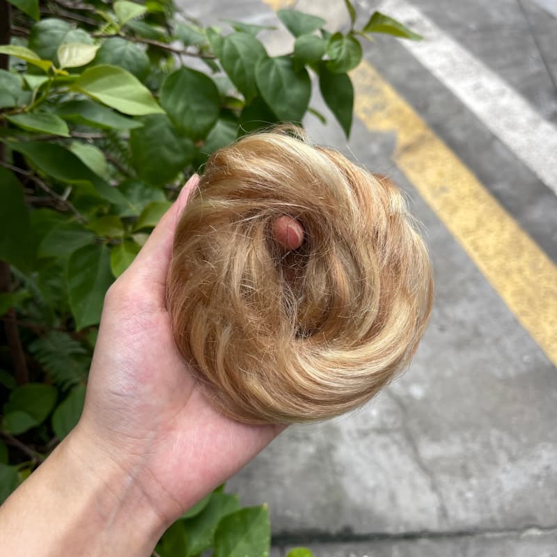 100% human hair bun scrunchie, color 18-613, outdoor natural-light photo 1