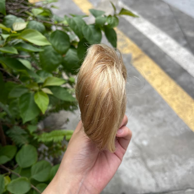 100% human hair bun scrunchie, color 18-613, outdoor natural-light photo 3