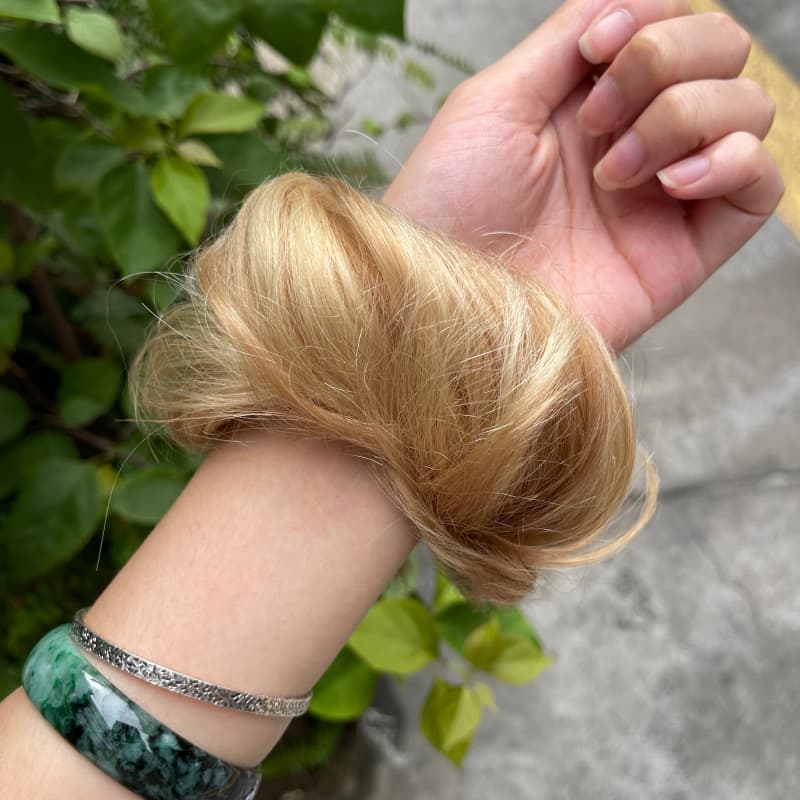 100% human hair bun scrunchie, color 18-613, outdoor natural-light photo 5