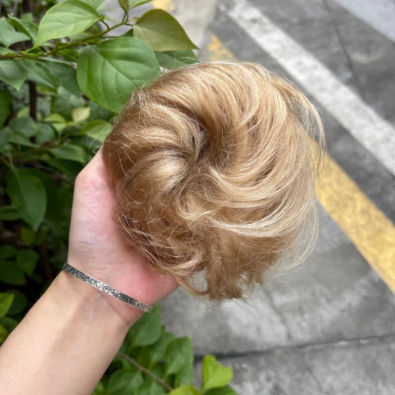 100% human hair bun scrunchie, color 19#, outdoor natural-light photo 1