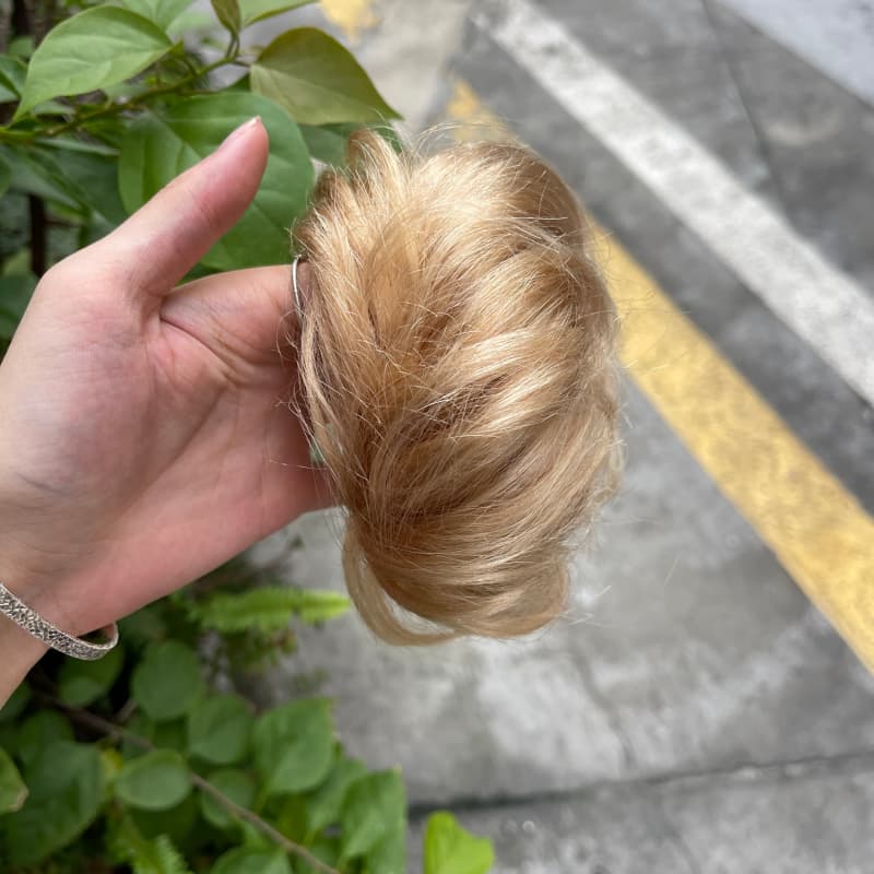 100% human hair bun scrunchie, color 19#, outdoor natural-light photo 2