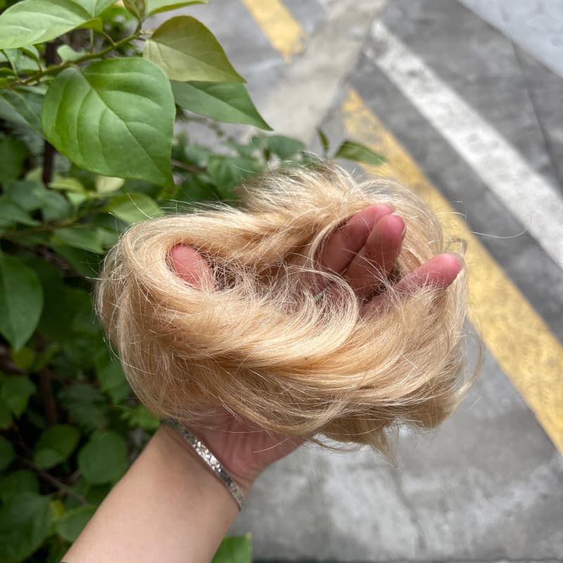 100% human hair bun scrunchie, color 19#, outdoor natural-light photo 4