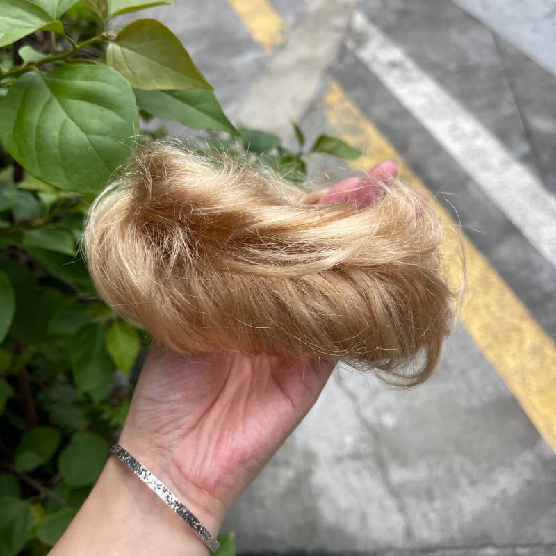 100% human hair bun scrunchie, color 19#, outdoor natural-light photo 5