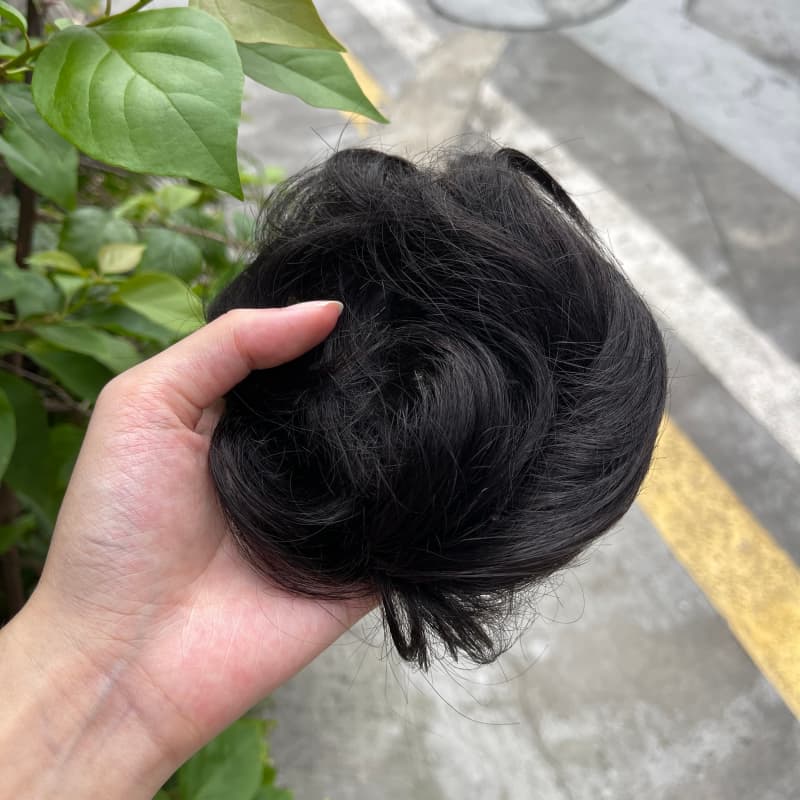 100% human hair bun scrunchie, color 1B#, outdoor natural-light photo 1
