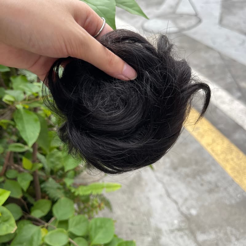 100% human hair bun scrunchie, color 1B#, outdoor natural-light photo 4