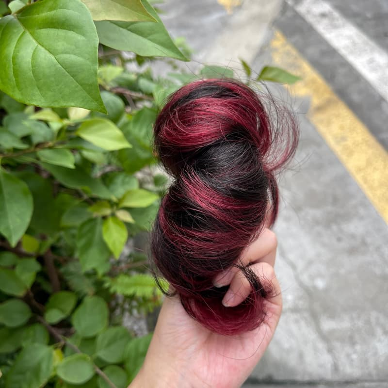 100% human hair bun scrunchie, color 1B99J, outdoor natural-light photo 2