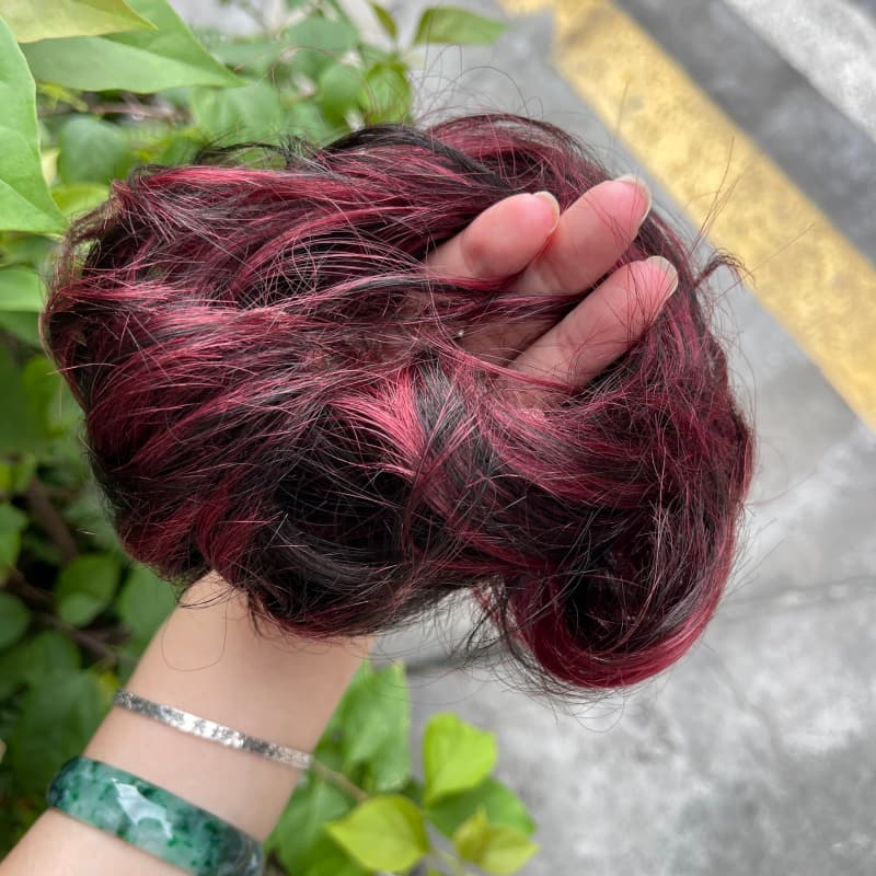 100% human hair bun scrunchie, color 1B99J, outdoor natural-light photo 5