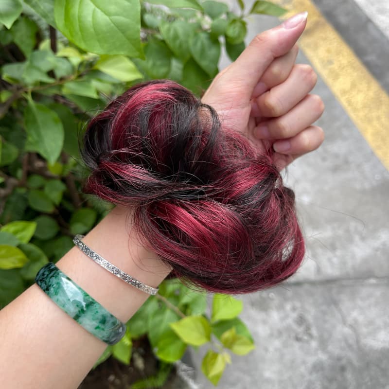 100% human hair bun scrunchie, color 1B99J, outdoor natural-light photo 6