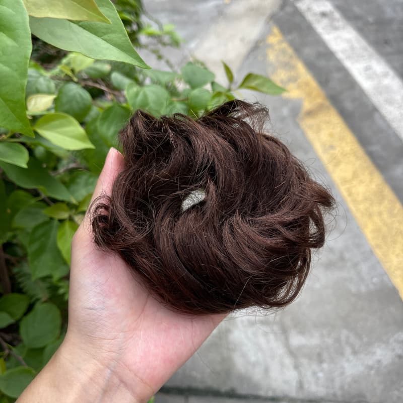 100% human hair bun scrunchie, color 2#, outdoor natural-light photo 1