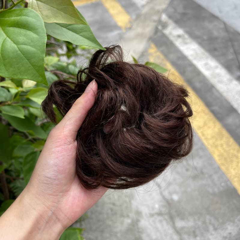 100% human hair bun scrunchie, color 2#, outdoor natural-light photo 3