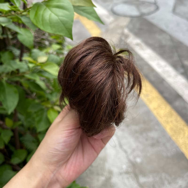100% human hair bun scrunchie, color 4#, outdoor natural-light photo 3