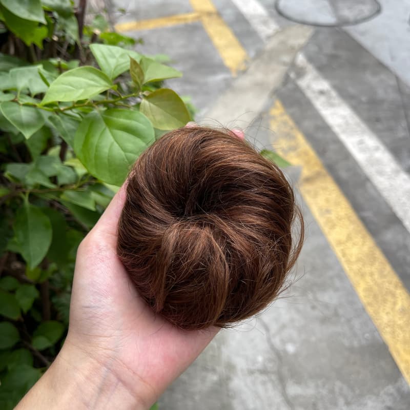 100% human hair bun scrunchie, color 4-6, outdoor natural-light photo 1