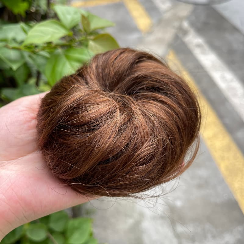 100% human hair bun scrunchie, color 4-6, outdoor natural-light photo 2
