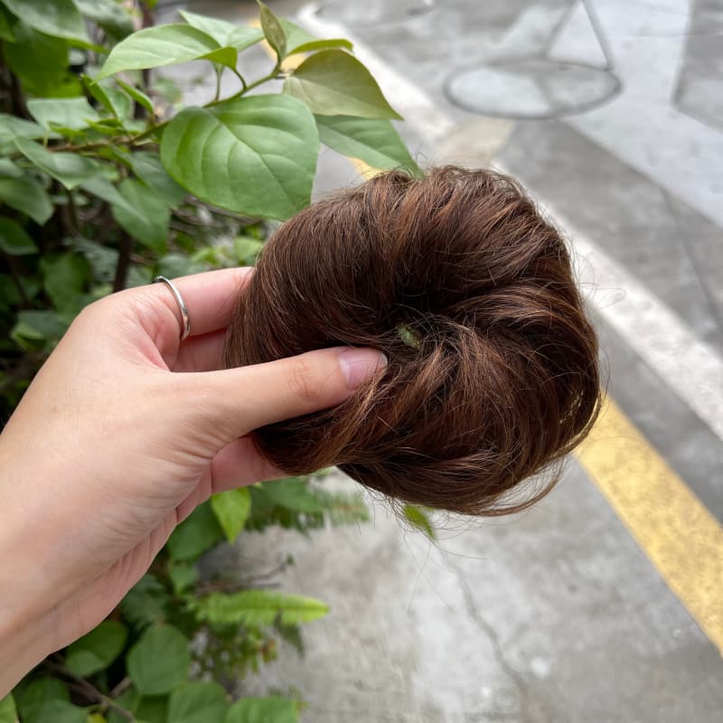 100% human hair bun scrunchie, color 4-6, outdoor natural-light photo 4