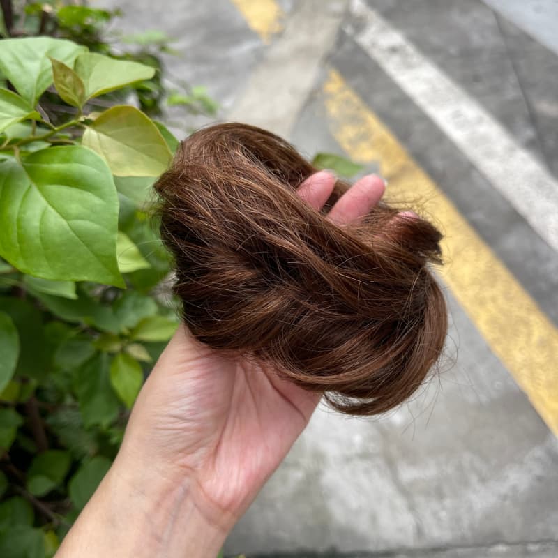 100% human hair bun scrunchie, color 4-6, outdoor natural-light photo 6