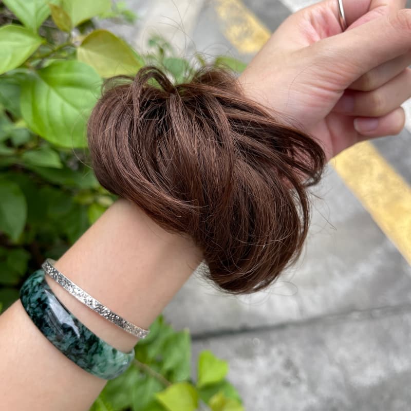 100% human hair bun scrunchie, color 4#, outdoor natural-light photo 7