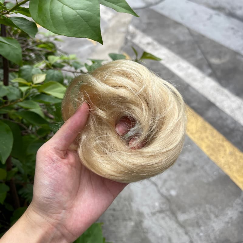 100% human hair bun scrunchie, color 613#, outdoor natural-light photo 2