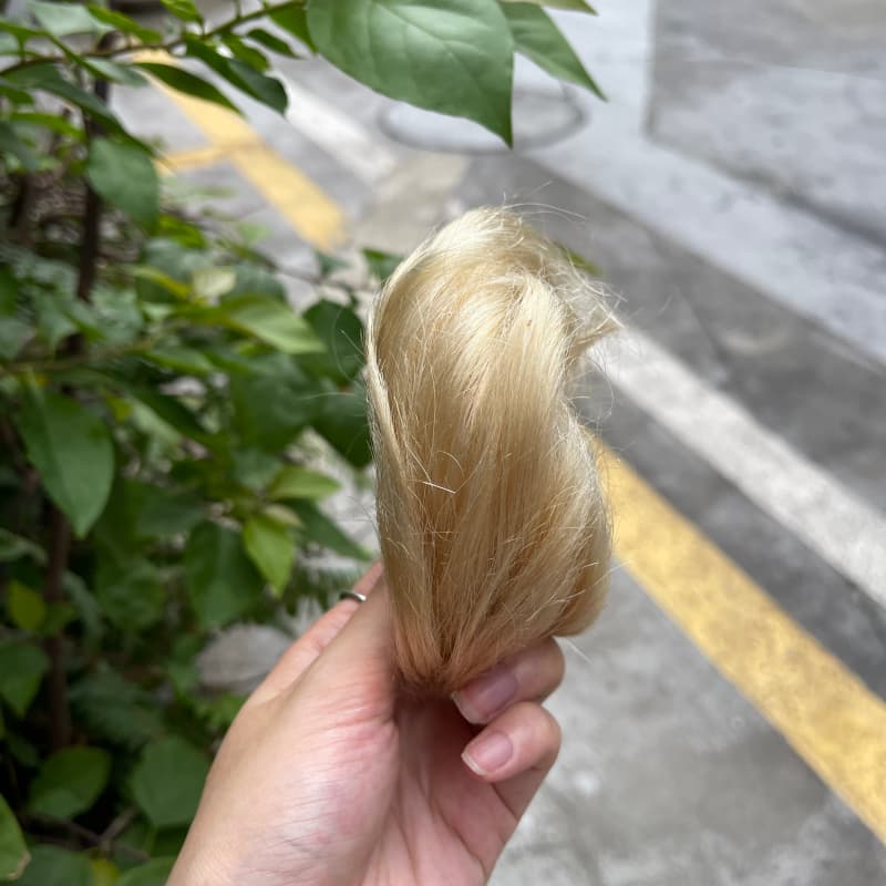 100% human hair bun scrunchie, color 613#, outdoor natural-light photo 4