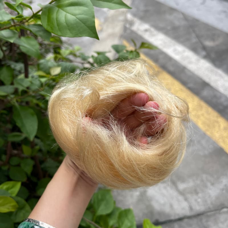 100% human hair bun scrunchie, color 613#, outdoor natural-light photo 5