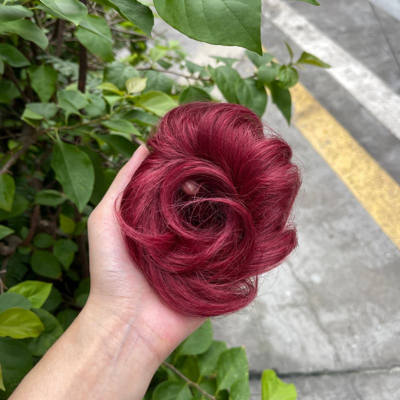 100% human hair bun scrunchie, color 99J#, outdoor natural-light photo 1