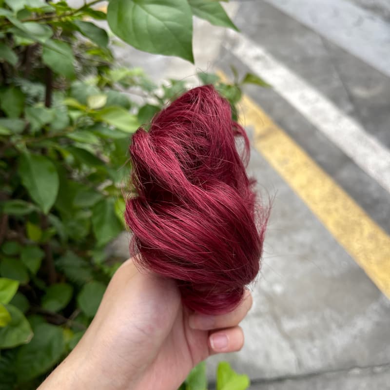 100% human hair bun scrunchie, color 99J#, outdoor natural-light photo 4
