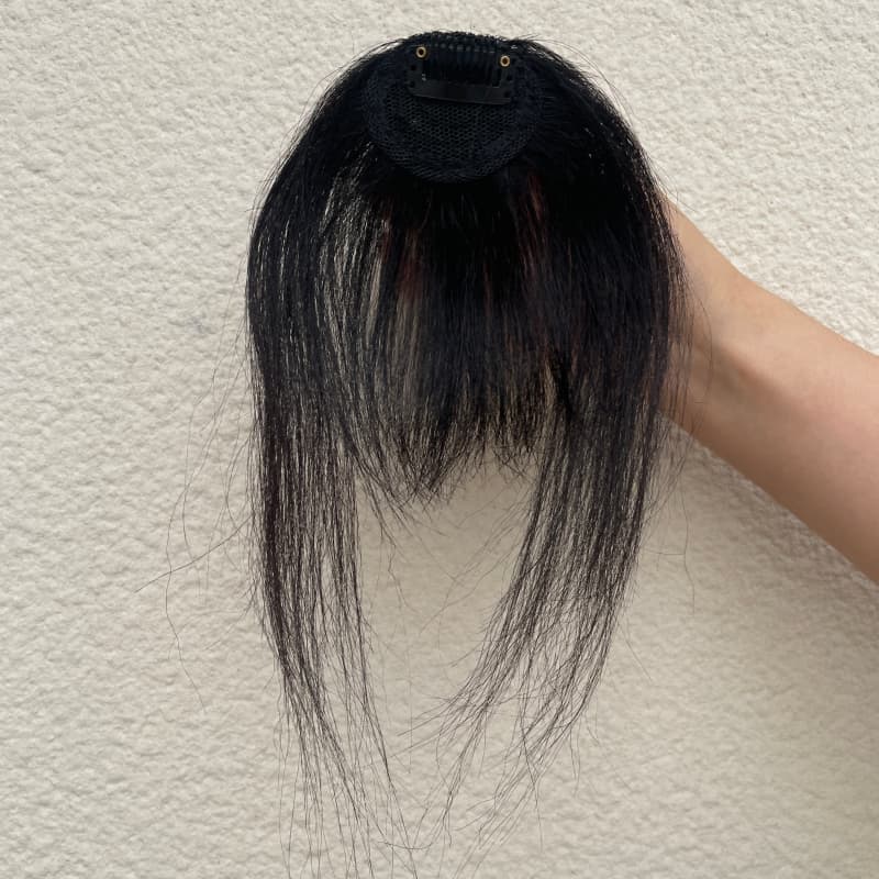 #1 jet black fringe hairpiece compact mesh base and single clip detail