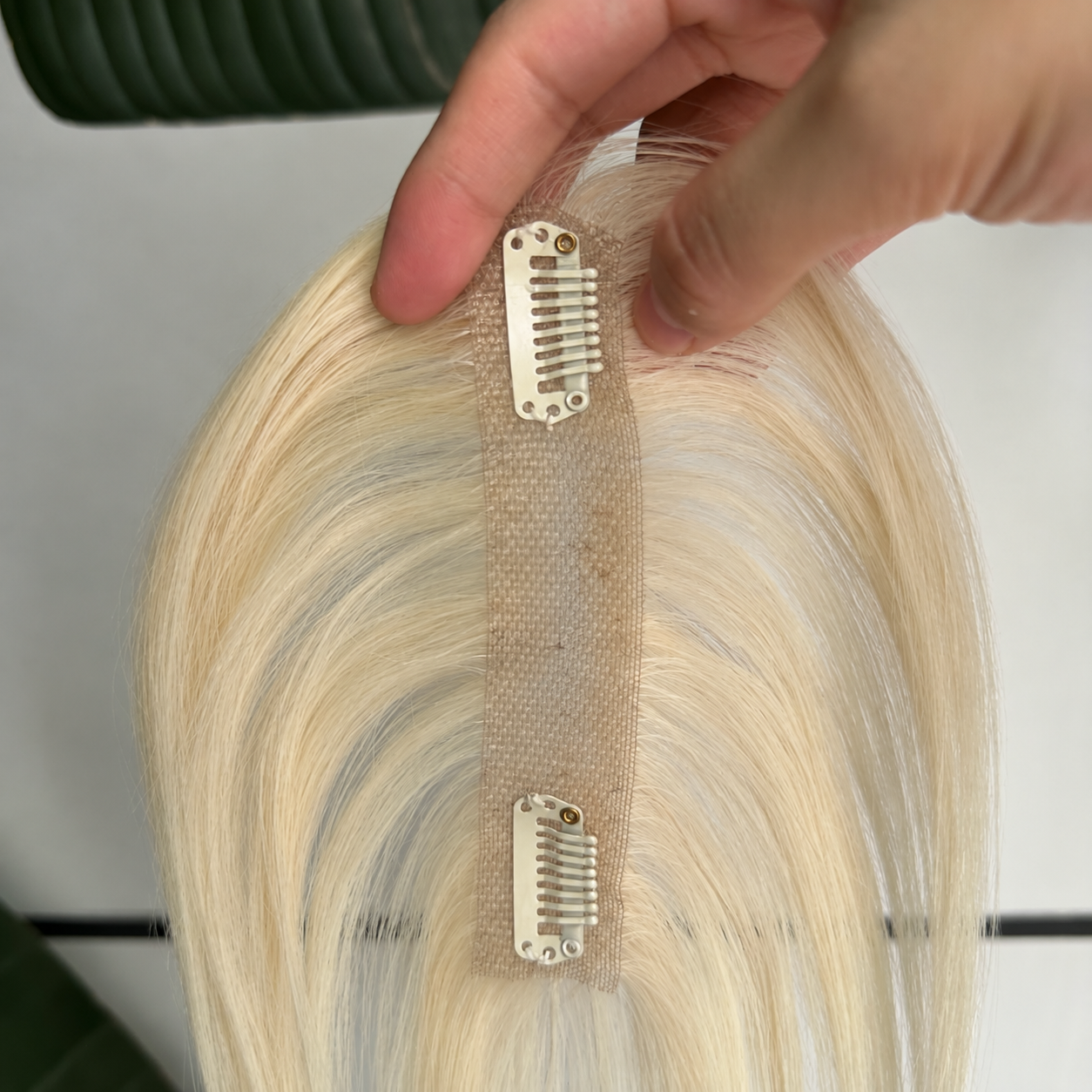 613 platinum blonde human hair topper narrow 2 by 12 cm lace base and two clips