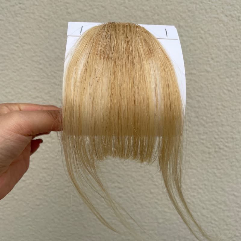 #613 blonde human hair clip-in bangs with longer face-framing sides