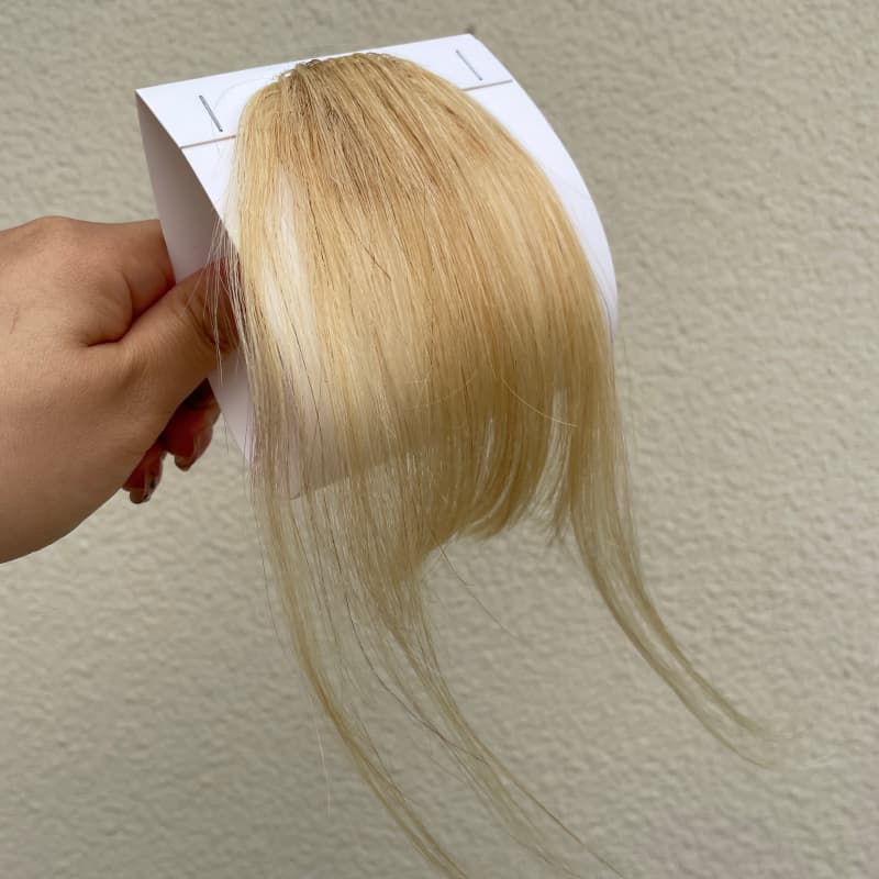 #613 blonde human hair clip-in bangs with longer face-framing sides