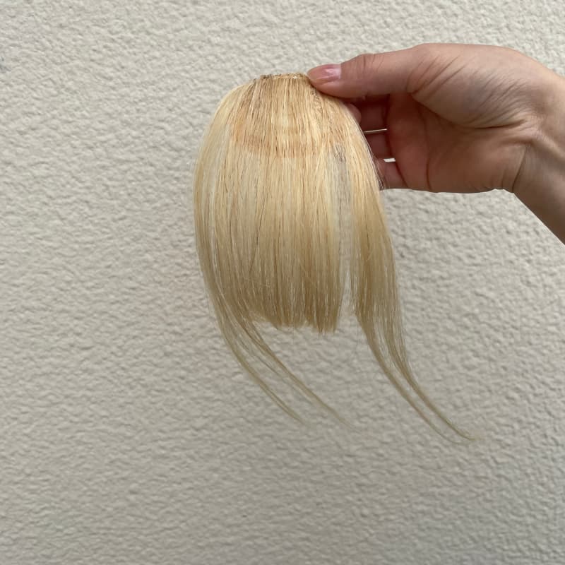 #613 blonde human hair clip-in bangs with longer face-framing sides
