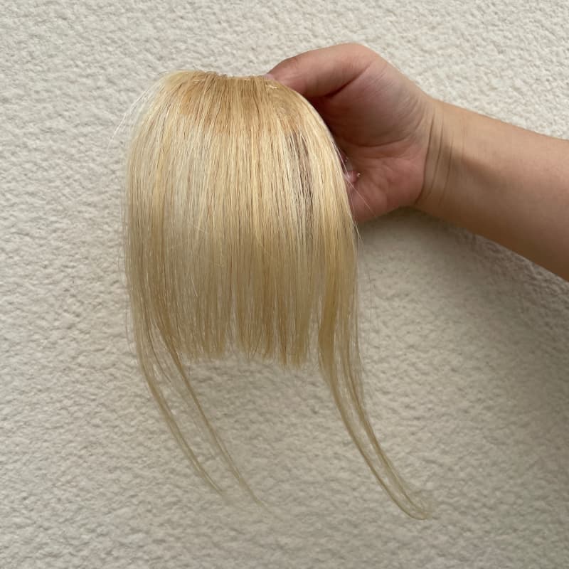 #613 blonde human hair clip-in bangs with longer face-framing sides