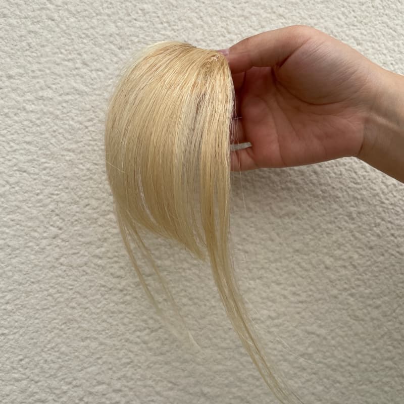 #613 blonde human hair clip-in bangs with longer face-framing sides