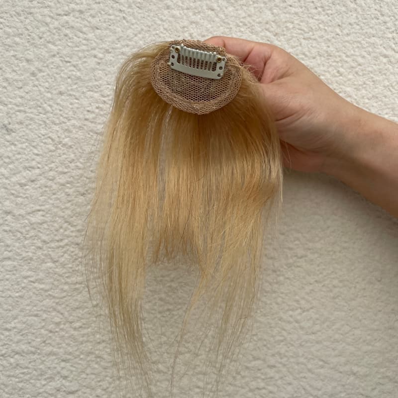 Ash blonde fringe hairpiece compact mesh base and single clip detail