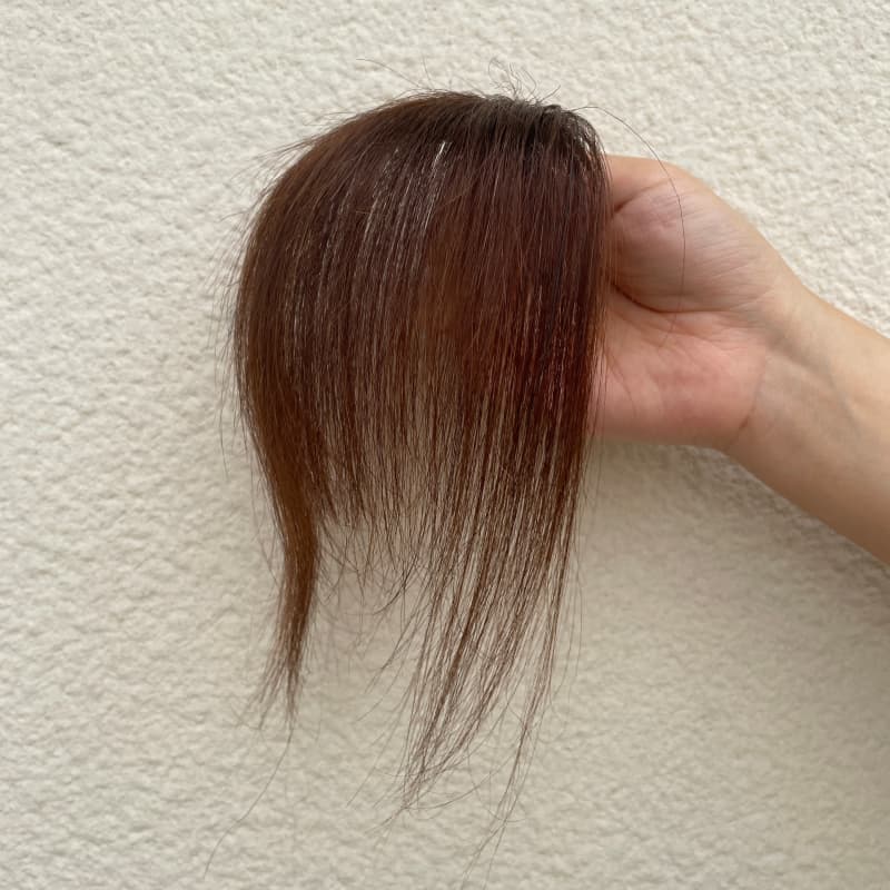 Dark brown human hair clip-in bangs with face-framing side strands