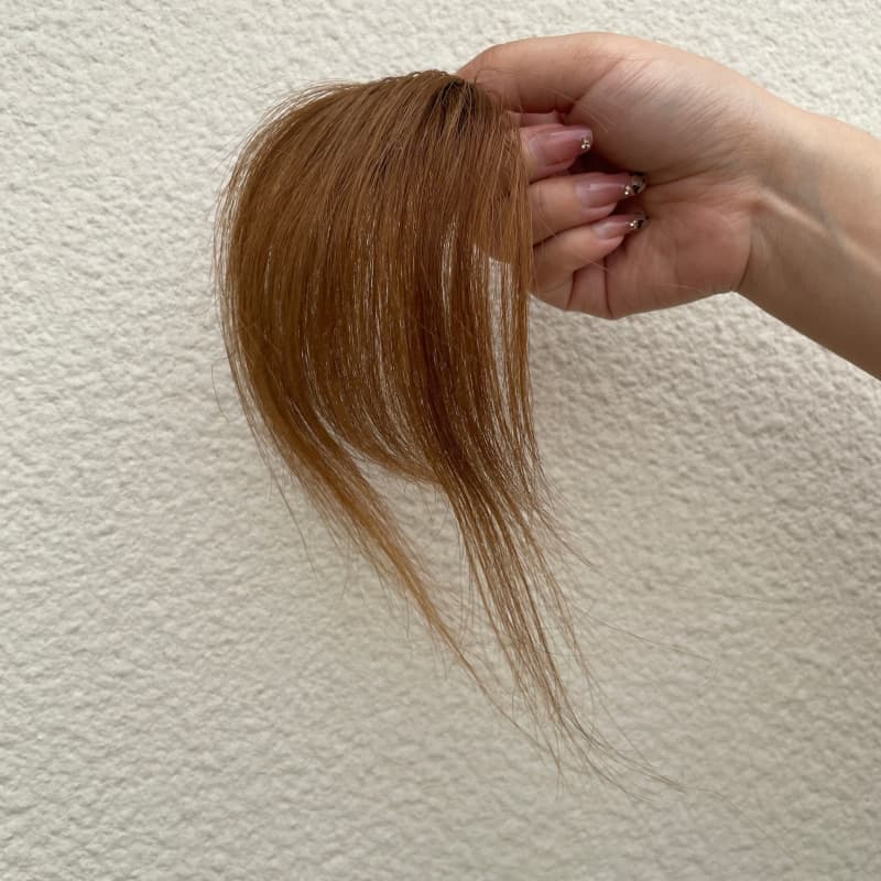 Medium brown human hair clip-in bangs with longer face-framing sides