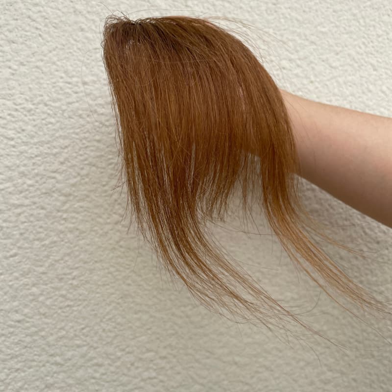 Medium brown human hair clip-in bangs with longer face-framing sides