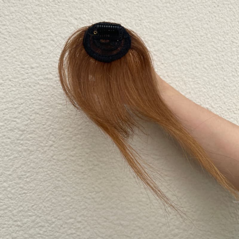 Medium brown clip-in fringe compact base and single clip detail