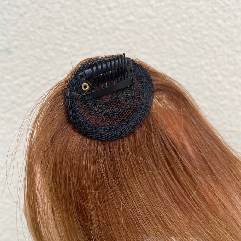 Medium brown clip-in fringe compact base and single clip detail