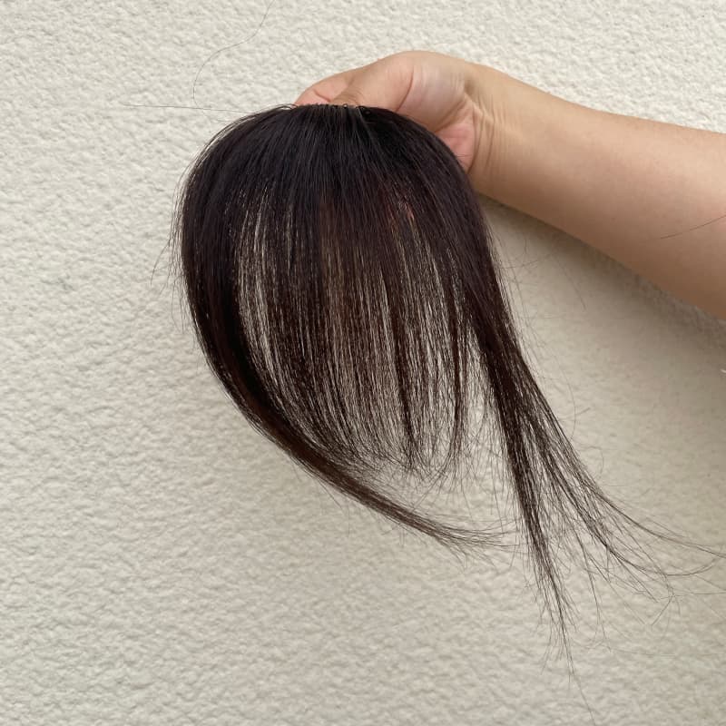 Natural black human hair clip-in bangs with face-framing side strands
