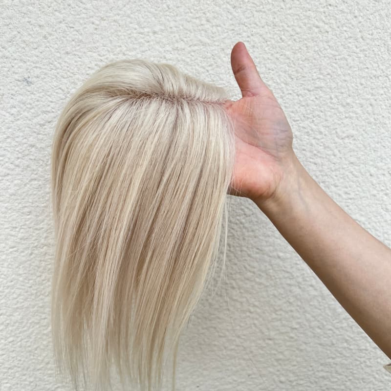 Ivory hair topper underside with clip-in attachments