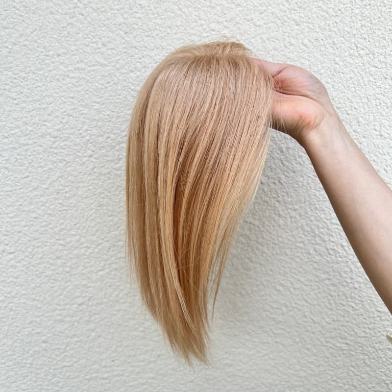Milk tea blonde clip-in hair topper showing the color and hair length